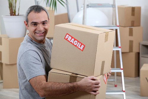 Moving van loading household items for a UK man and a van service