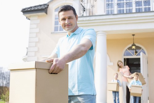 Loading furniture into a removal truck during a house move
